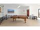 Finished basement featuring a billiards table, custom bar stools, and mounted television, great for entertaining at 2731 W Desert Ranch Rd, Phoenix, AZ 85086