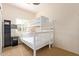 Bright bedroom with a white bunk bed, complemented by a side table and modern lamp near the window at 2731 W Desert Ranch Rd, Phoenix, AZ 85086