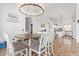 Dining room features a large table and chairs, decorative chandelier, and access to the kitchen at 2731 W Desert Ranch Rd, Phoenix, AZ 85086