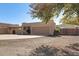 Front exterior view of a home featuring a large garage and desert-style landscaping at 2731 W Desert Ranch Rd, Phoenix, AZ 85086