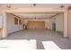 Spacious garage with epoxy flooring, built-in storage cabinets, and ample room for vehicles at 2731 W Desert Ranch Rd, Phoenix, AZ 85086