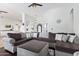 Spacious living room featuring a sectional sofa, hardwood floors, and a view of the entryway at 2731 W Desert Ranch Rd, Phoenix, AZ 85086