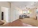 Spacious living room with a cozy seating area, a ceiling fan, two windows, and access to a closet at 2731 W Desert Ranch Rd, Phoenix, AZ 85086