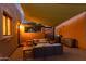 Outdoor patio area with comfortable seating, grilling area, and sunset at 2731 W Desert Ranch Rd, Phoenix, AZ 85086