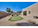 The backyard includes a putting green, desert landscaping, and a charming walkway at 2731 W Desert Ranch Rd, Phoenix, AZ 85086