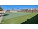Backyard sport court featuring basketball and putting green provides recreation at home at 2731 W Desert Ranch Rd, Phoenix, AZ 85086