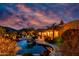 Backyard swimming pool and spa, with lush landscaping at dusk at 2731 W Desert Ranch Rd, Phoenix, AZ 85086
