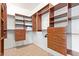 Walk-in closet with custom shelving and drawers for optimal storage and organization at 2731 W Desert Ranch Rd, Phoenix, AZ 85086