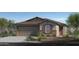 Charming single-story home with a two-car garage and desert landscaping at 2735 W La Mirada Dr, Laveen, AZ 85339