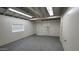 Spacious garage with ample lighting and a large door at 2908 N 53Rd Ln, Phoenix, AZ 85031