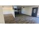 Open-concept living room with sleek flooring and modern finishes at 2908 N 53Rd Ln, Phoenix, AZ 85031