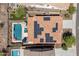 An aerial view of solar panels on the home's roof and a pool at 31046 N 138Th Ave, Peoria, AZ 85383