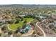 Community aerial view showcasing green spaces, parks, and a clubhouse with a pool and recreation area at 31046 N 138Th Ave, Peoria, AZ 85383