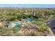 Aerial view of community pool showcasing a refreshing oasis surrounded by lush greenery and desert landscape at 31046 N 138Th Ave, Peoria, AZ 85383