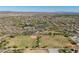 Aerial view of a planned community featuring baseball fields, swimming pools, and desert landscaping at 31046 N 138Th Ave, Peoria, AZ 85383