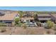 Aerial view of a home with a pool, lawn, and mountain views at 31046 N 138Th Ave, Peoria, AZ 85383