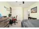 Bright bedroom features gaming setup, large closet, and neutral decor for a comfortable and personalized space at 31046 N 138Th Ave, Peoria, AZ 85383
