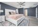 Comfortable bedroom features a modern ceiling fan, white trim, and a beautiful accent rug at 31046 N 138Th Ave, Peoria, AZ 85383