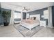 Bright bedroom boasts lots of natural light, ceiling fan, and a charming bench seat at 31046 N 138Th Ave, Peoria, AZ 85383