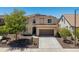 Charming two-story home with a well-manicured front yard and tile roof at 31046 N 138Th Ave, Peoria, AZ 85383