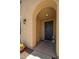 Cozy front porch adorned with charming decor, including a lovely wreath and stylish lantern at 31046 N 138Th Ave, Peoria, AZ 85383