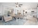 Bright and spacious living room with a plush sectional sofa, creating a cozy and inviting atmosphere at 31046 N 138Th Ave, Peoria, AZ 85383
