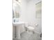 Neat powder room is complete with a modern sink, tiling, and neutral paint job at 31046 N 138Th Ave, Peoria, AZ 85383