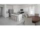A modern kitchen with stainless steel appliances, a granite countertop island and a cozy dining area at 3948 E San Jose St, San Tan Valley, AZ 85143