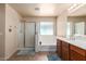 Bright bathroom showcasing a shower, soaking tub, and double sink vanity at 42160 W Arvada Ct, Maricopa, AZ 85138