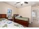 Bedroom featuring two beds with built-in storage and a ceiling fan at 42160 W Arvada Ct, Maricopa, AZ 85138