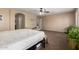Bright bedroom with a ceiling fan, neutral walls, and a comfortable bed at 42160 W Arvada Ct, Maricopa, AZ 85138
