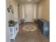 Inviting entryway with decorative tile inlay, console table, and shoe storage for organized living at 42160 W Arvada Ct, Maricopa, AZ 85138