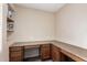Dedicated office space with built-in desk and storage cabinets, perfect for working from home at 42160 W Arvada Ct, Maricopa, AZ 85138