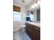 A stylish bathroom showcasing a modern vanity, ample lighting, and a clean, contemporary design at 4961 W Walatowa St, Laveen, AZ 85339