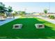 A community area showcasing turf, walking path, horseshoe pits, and beautiful landscaping at 4961 W Walatowa St, Laveen, AZ 85339