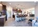 A spacious open-concept kitchen that connects to the living and dining areas, featuring modern appliances and ample countertop space at 4961 W Walatowa St, Laveen, AZ 85339