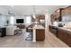The open-concept layout connects the kitchen, dining, and living areas for seamless entertaining and Gathering living at 4961 W Walatowa St, Laveen, AZ 85339