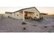 Spacious backyard patio area with comfortable seating and a lovely fire pit at 5019 W Walatowa St, Laveen, AZ 85339