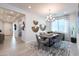Elegant dining room featuring stylish decor, modern lighting, and a comfortable seating arrangement at 5019 W Walatowa St, Laveen, AZ 85339