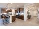 Modern kitchen showcasing an island with bar seating, stainless steel appliances, and ample counter space at 5019 W Walatowa St, Laveen, AZ 85339