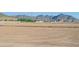 Large vacant lot with mountain views in the distance, ready for development at 5019 W Walatowa St, Laveen, AZ 85339