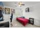 Cozy bedroom with ceiling fan, a desk, and a window for plenty of natural light at 5133 E Juana Ct, Cave Creek, AZ 85331