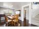 Elegant dining room featuring hardwood floors, a large mirror, and a classic wooden dining set at 5133 E Juana Ct, Cave Creek, AZ 85331