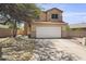 Inviting two-story home featuring a tile roof and a spacious two-car garage for modern living at 5133 E Juana Ct, Cave Creek, AZ 85331