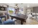 Bright game room with ping pong table, natural light, sports decor, and laminate flooring at 5133 E Juana Ct, Cave Creek, AZ 85331