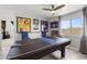 Recreational room with ping pong, sports decor, ample lighting, and a view to the outdoor area at 5133 E Juana Ct, Cave Creek, AZ 85331