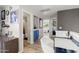 A hallway with built-in blue cabinets offering access to the main bedroom and bathroom at 5133 E Juana Ct, Cave Creek, AZ 85331