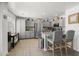 Spacious kitchen featuring stainless steel appliances, gray cabinets, tile flooring, and an island with seating at 5133 E Juana Ct, Cave Creek, AZ 85331
