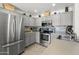 Well-lit kitchen with stainless steel appliances, tile backsplash, and ample cabinet space at 5133 E Juana Ct, Cave Creek, AZ 85331
