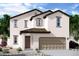 Charming two-story home featuring a stucco facade, tiled roof, arched entry and attached two-car garage at 5830 W Sunrise Dr, Laveen, AZ 85339